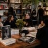 People gathering in an independent bookstore to explore fashion books and creative ideas, illustrating how fashion and independent bookstores bring communities together