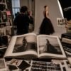 Fashion photography studio with an open photo book, capturing the creative process and stories behind books in fashion from concept to finished publication.